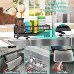 Black stainless steel self-draining sink caddy with compartments for sponges, brushes, and a hanging dishcloth.