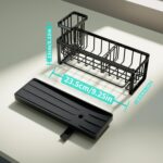 Black stainless steel self-draining sink caddy with compartments for sponges, brushes, and a hanging dishcloth.