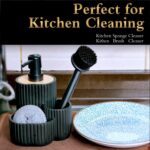 A matte black Kmass Kmaxx 3-in-1 sink caddy organizer with a soap dispenser, sponge, and dish brush holder.