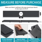 Dark gray diatomite stone faucet mat with a rectangular shape, placed around a kitchen sink faucet with items on it.
