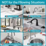 Dark gray diatomite stone faucet mat with a rectangular shape, placed around a kitchen sink faucet with items on it.