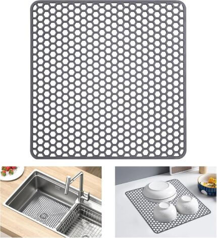 A gray Myirxcv 13.58 inch square silicone sink protector mat with raised nodules, shown unfolded in a kitchen sink.