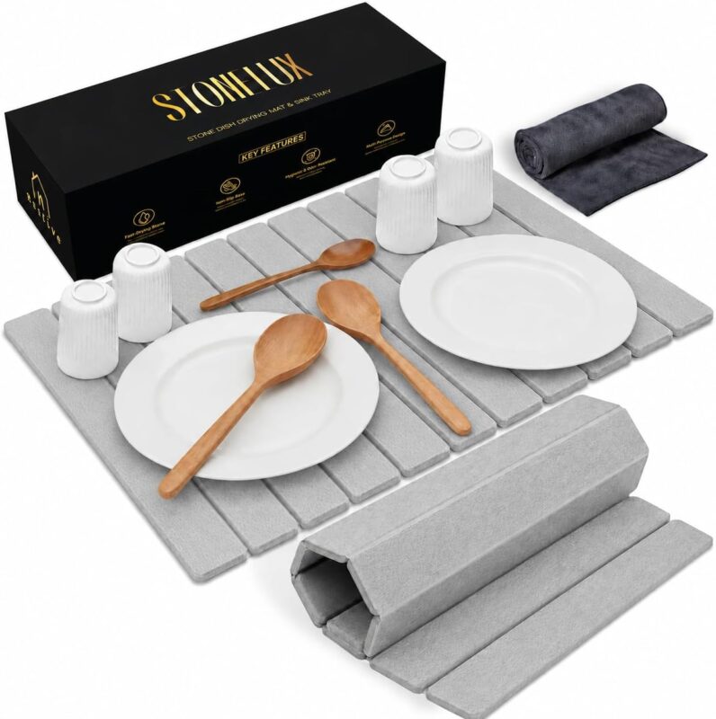 Light gray Nestive foldable diatomite stone drying mat with dishes and cups drying on a kitchen counter