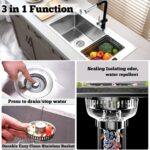 Close-up of a silver brushed stainless steel kitchen sink drain strainer with pop-up stopper in a kitchen sink.