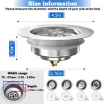 Close-up of a silver brushed stainless steel kitchen sink drain strainer with pop-up stopper in a kitchen sink.