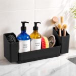 Black sponge holder for kitchen sink with a white drying stone and two removable cups, holding sponges and brushes.