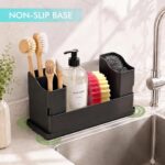 Black sponge holder for kitchen sink with a white drying stone and two removable cups, holding sponges and brushes.