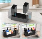 Black sponge holder for kitchen sink with a white drying stone and two removable cups, holding sponges and brushes.